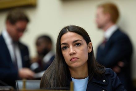 Rep. Alexandria Ocasio-Cortez, D-N.Y., listens as Federal Reserve Chairman Jerome Powell testifies b...