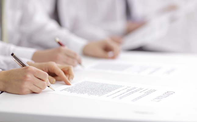 close up. business team studying the terms of the contract