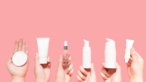 Skincare routine step for healthy skin - Woman hands holding facial cotton pad, foam, essential oil,...