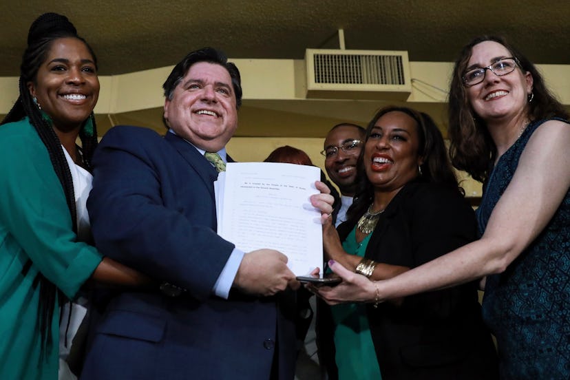 Gov. J. B. Pritzker holds a bill that legalizes adult-use cannabis in the state of Illinois at Sanko...