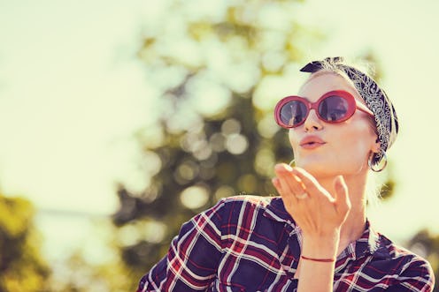 Summer girl with flying kisses