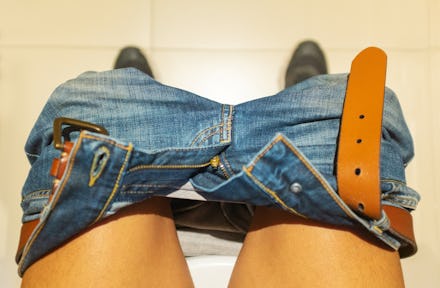a man sitting on the toilet