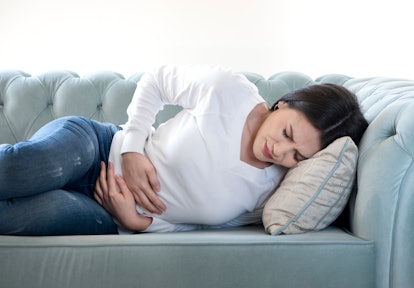 Young woman with stomach pain