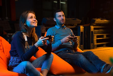 Playing video games while sitting on sofa