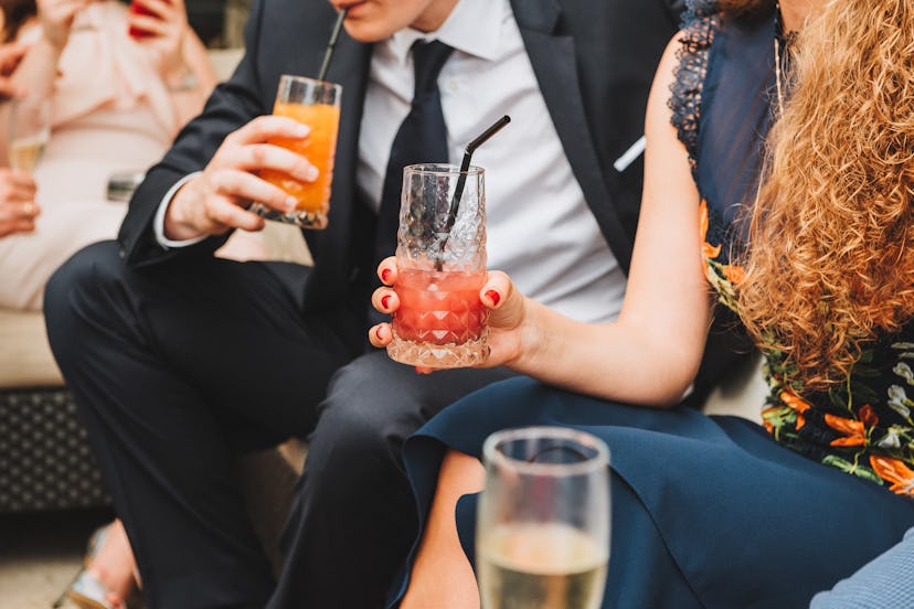 People drinking soft drinks at a social event