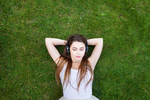 enjoy the music, top view of young woman in headphones, background