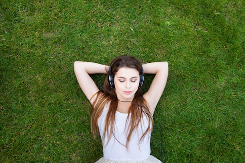 enjoy the music, top view of young woman in headphones, background