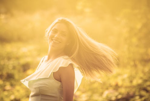 I am happy woman. Happy woman on field. Close up.