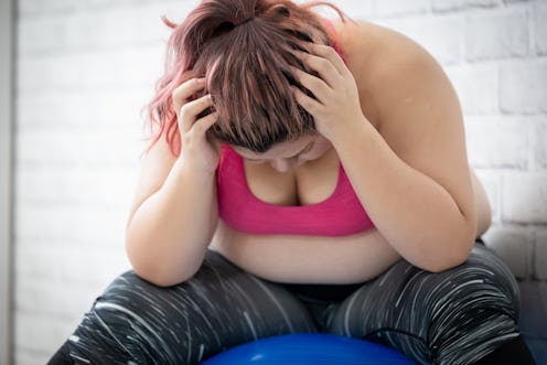 plus size asian girl feel upset when exercising