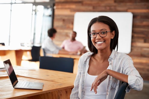 Portrait of young black woman in creative office