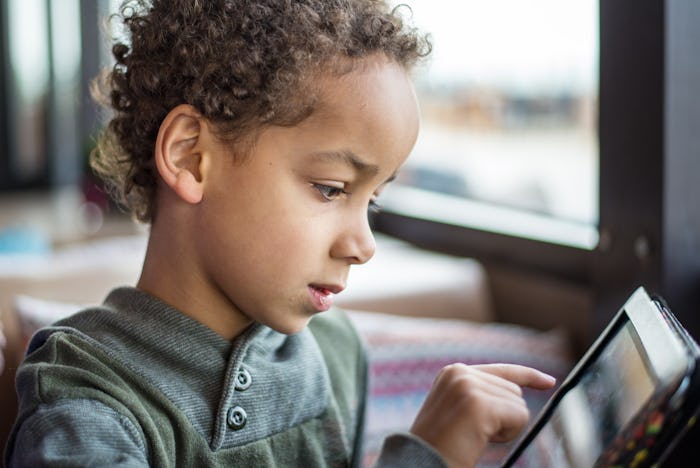 Cute boy playing with tablet - Kid with tablet - Little boy with tablet pc computer at home