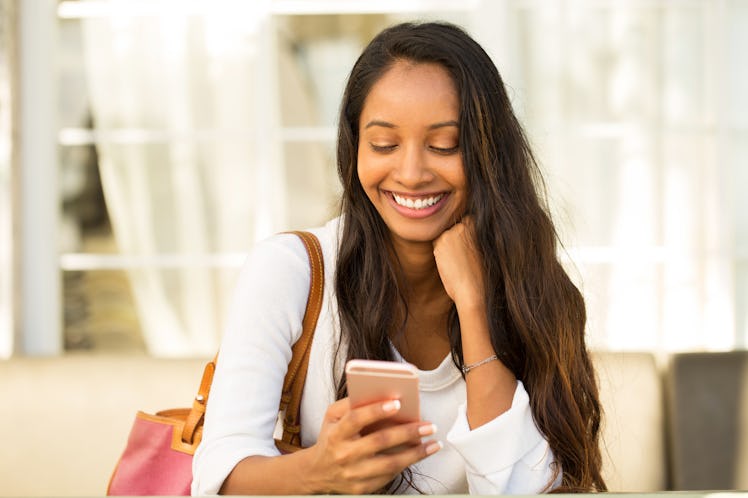 Woman texting on her phone.