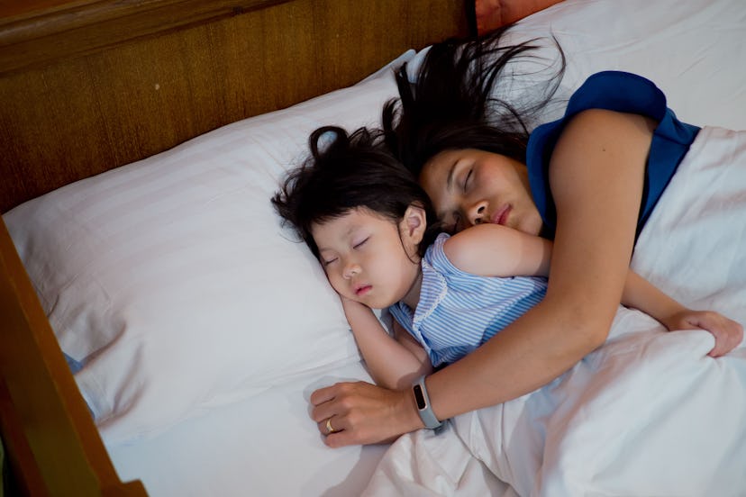 asian girl sleep on bed with mom, kid sick, child sleep
