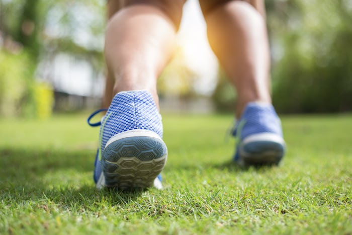 Women running jogging in nature. On the lawn in the morning.
