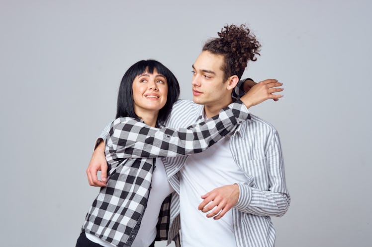 woman and man hug each other