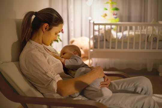 mom breastfeeding her baby at night