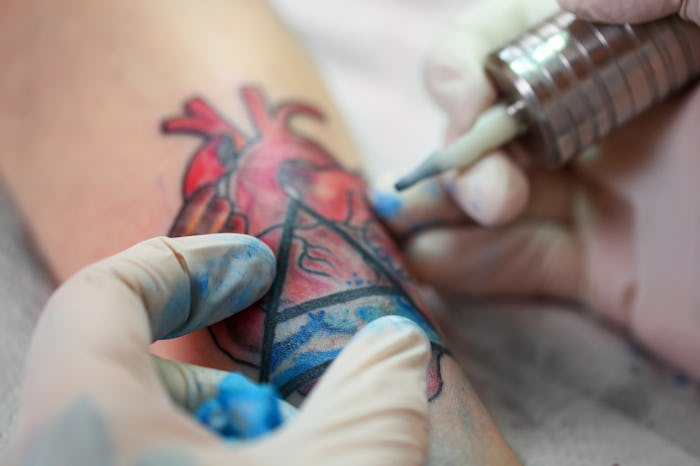Tattoo artist at work, close-up