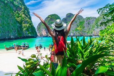 Traveler woman joy fun on tropical beach forest look beautiful nature paradise beach Maya bay Krabi,...