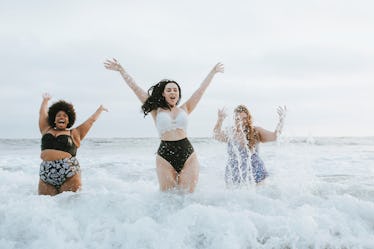 Diverse plus size women having fun in the water