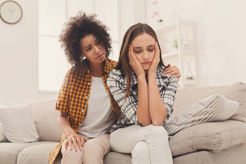Woman consoling her depressed friend at home, closeup. Female friendship, support and care, copy spa...