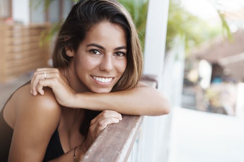 Close-up lovely tanned girlfriend pierced nose tanned skin lean handrail cafe terrace turn camera ha...
