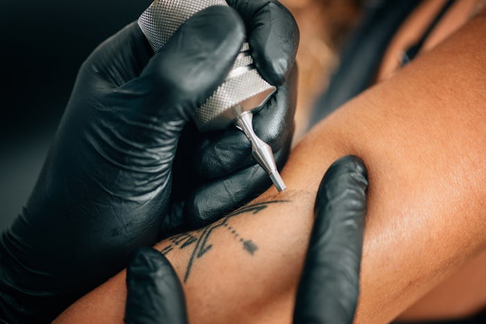 woman getting a tattoo