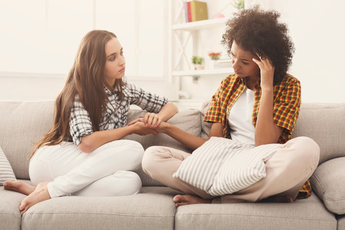 Two women talking about problems at home. 