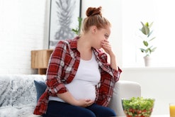 Young pregnant woman suffering from morning sickness