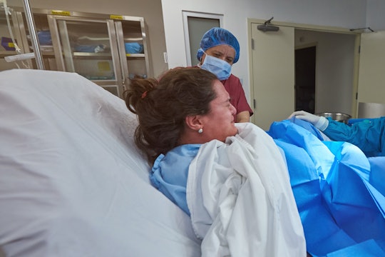 A woman in labor in a hospital