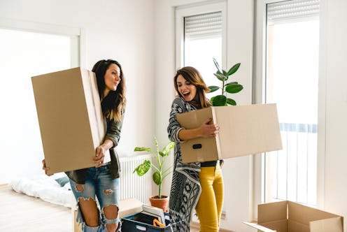 Lesbian couple moving into a new apartment	
