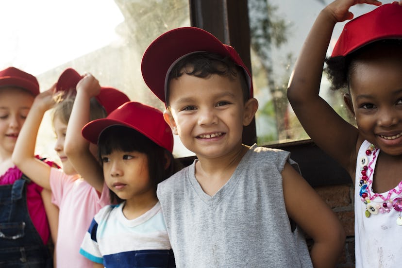 Group of kindergarten kids little farmers learning gardening