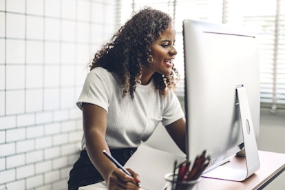 African american black woman working with laptop computer.creative business people planning and usin...