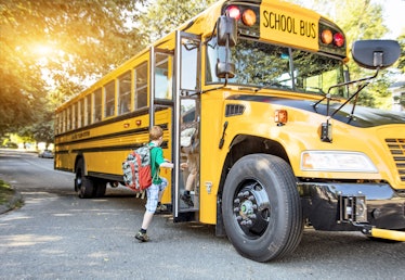 Children board a schoolbus, which may be soon replaced by a new low or no-emissions bus thanks to an...