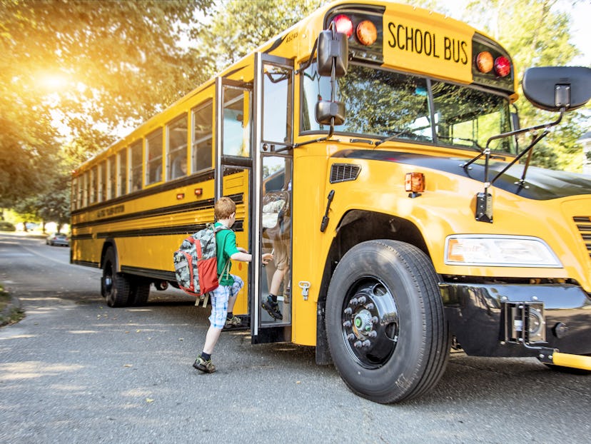 Children board a schoolbus, which may be soon replaced by a new low or no-emissions bus thanks to an...