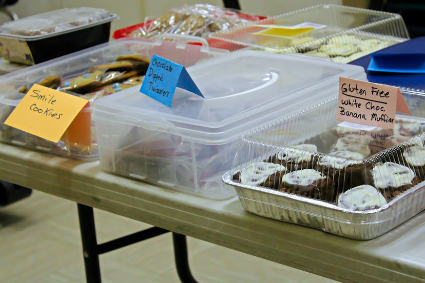 Items set up on a table at a bake sale.