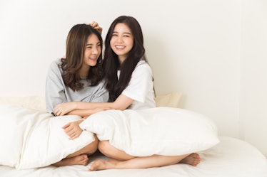 Young Asian Girls chit chat on the bed