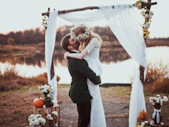  bride and groom on wedding ceremony on rustic autumn wedding