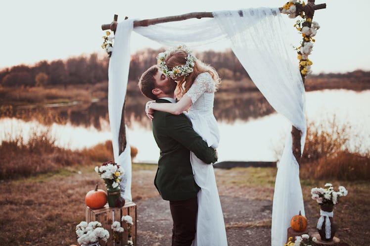 bride and groom on wedding ceremony on rustic autumn wedding