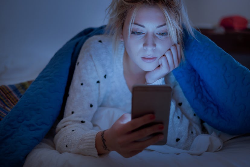 Instagram captions for middle of the night, sleepy woman looking at phone 