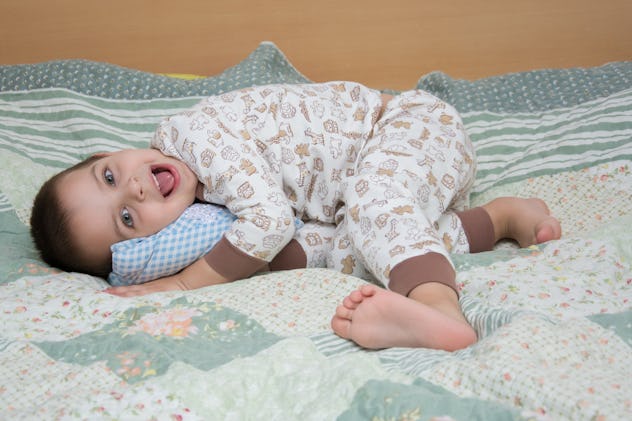 a boa child jumps on a bed, emotions on a child s face