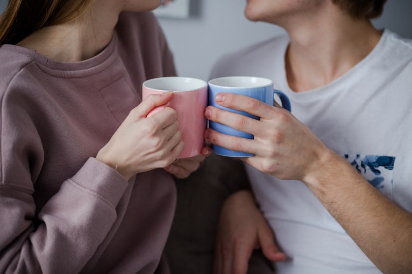 Having coffee they are discussing ther relationships. A kiss is close.