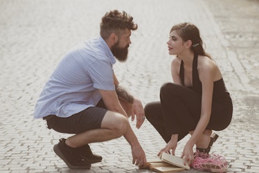 Love at first sight. Man and woman falling in love. Bearded man and cute woman met on street. Hipste...