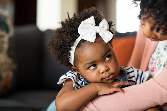 African American mother parenting her young child.