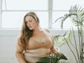 Beautiful and confident plus size woman in nude underwear