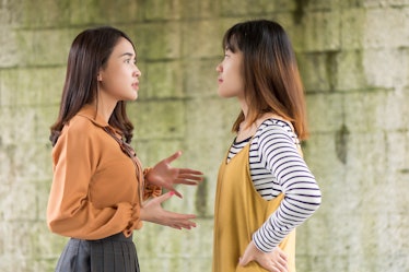 two women having conflict, arguing each other