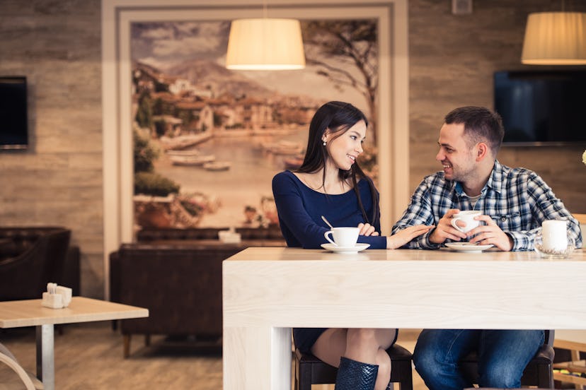 Young couple talking in coffee shop