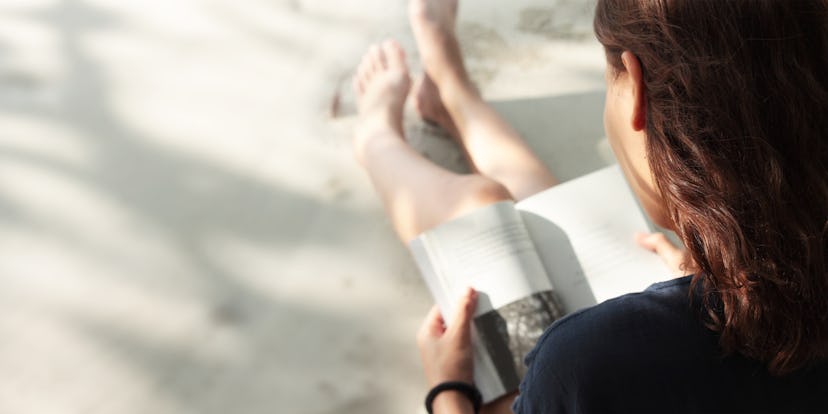 Woman reading book on the Beach