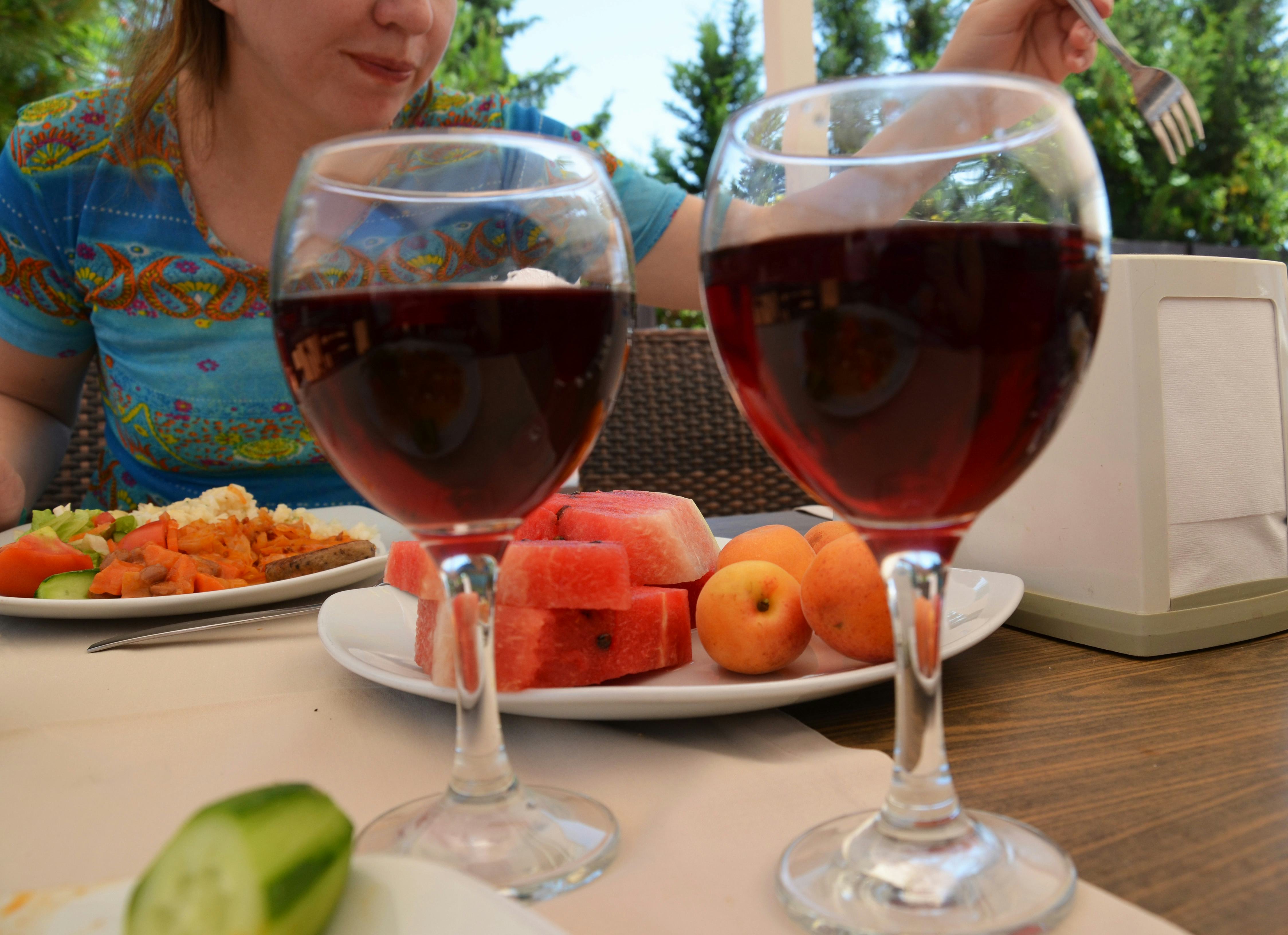 Two female friends drinking wine in restaurant