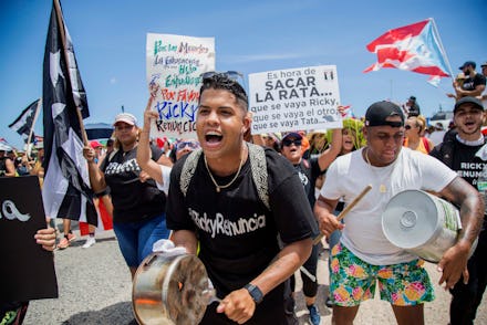 Demonstrators bang on pots and buckets as they march on Las Americas highway demanding the resignati...