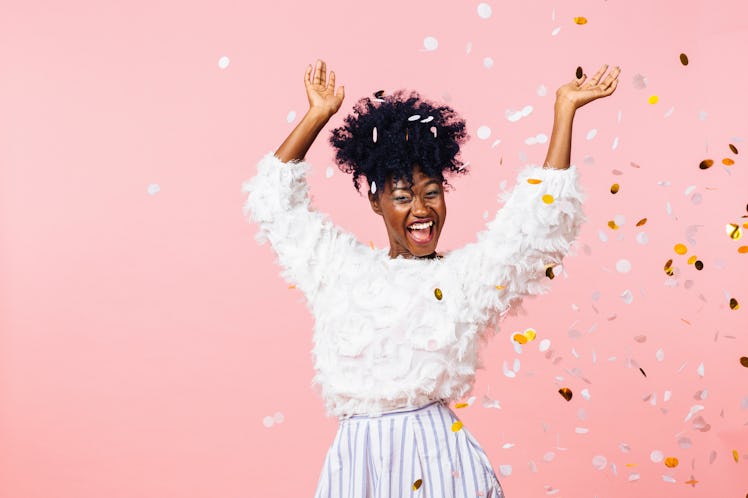 Fun party girl, smiling woman throwing confetti